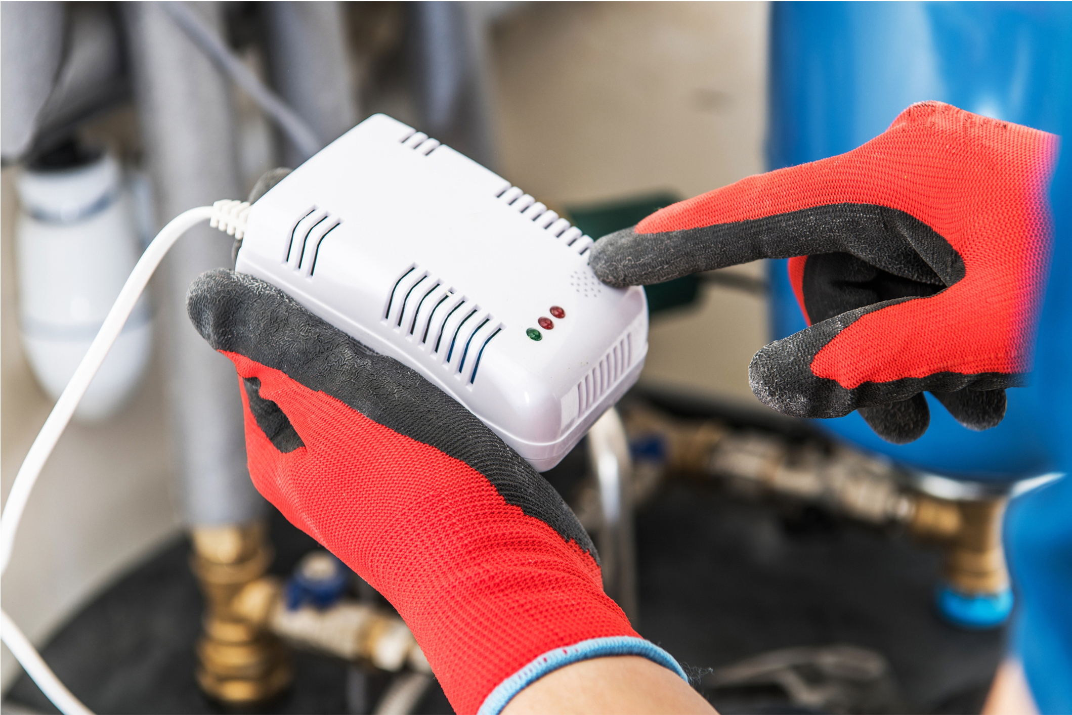 Professional HVAC technician performing a carbon monoxide test on a home