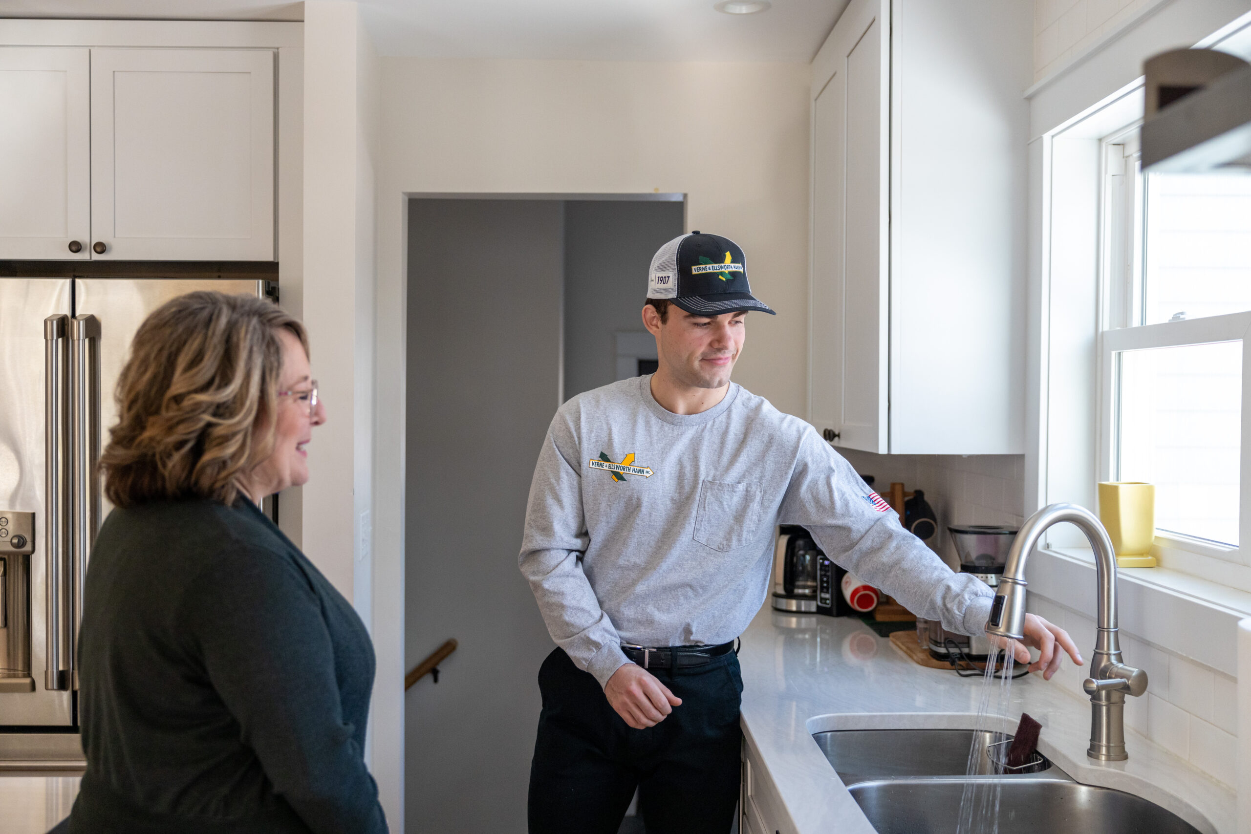 Verne & Ellsworth Hann team member speaking with a homeowner in Mayfield Heights